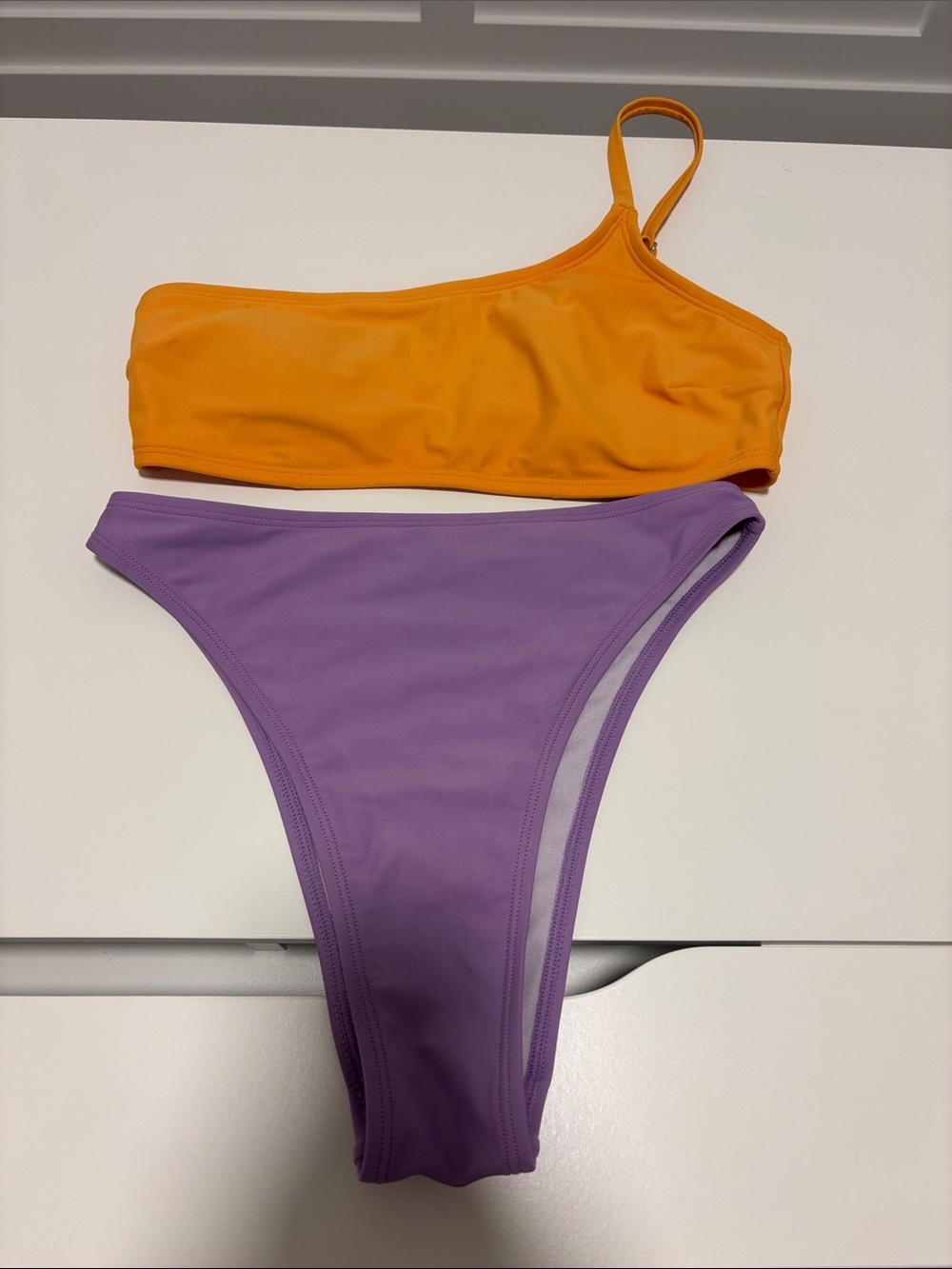 One-Shoulder Orange Bikini Top & Lavender High-Cut Bottom